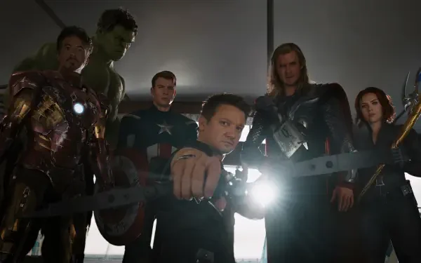 HD PC desktop wallpaper featuring Avengers superheroes including Captain America, Iron Man, Thor, Hawkeye, and Hulk standing together in a dramatic, shadowed scene.