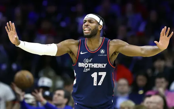 HD PC wallpaper featuring NBA player Buddy Hield in a Los Angeles Clippers uniform, actively gesturing on the basketball court during a game.