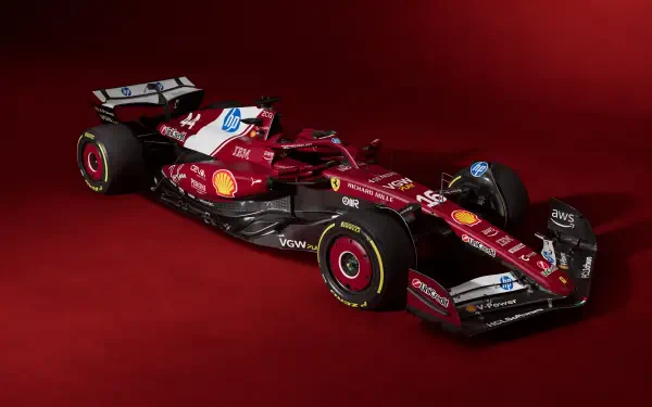 Red Ferrari SF-25 Formula 1 car showcased in 4K Ultra HD as a sleek racing machine against a matching red background.