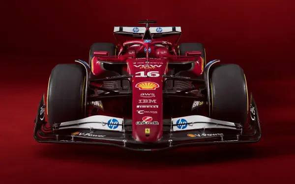 Front view of a red Ferrari SF-25 F1 car, captured in 4K Ultra HD, set against a deep red background.