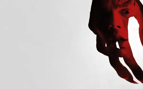 Nosferatu (2024) 4K Ultra HD PC desktop wallpaper featuring a dark, eerie figure partially obscured by shadow and red lighting on a light gray background.
