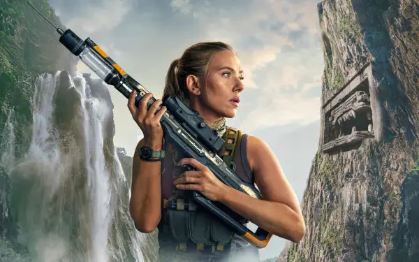 A focused woman holding a futuristic rifle stands against a backdrop of towering cliffs and waterfalls in this Jurassic World Rebirth 4K Ultra HD PC desktop wallpaper.