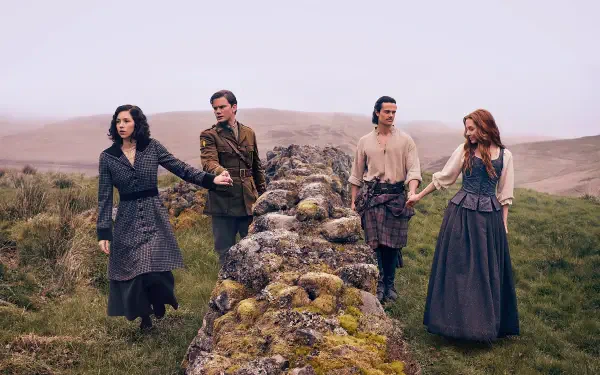 HD desktop wallpaper featuring four characters from the TV show Outlander: Blood of My Blood standing outdoors by a stone wall in a misty, grassy landscape.