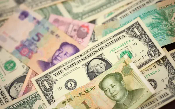 HD PC desktop wallpaper of a colorful spread of international banknotes and dollar bills — a money-themed background.