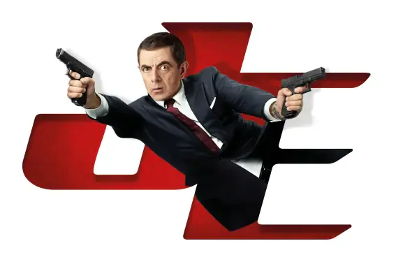 8K Ultra HD PC wallpaper: a suited comedic secret agent lunges forward, dual-wielding pistols over a bold red stylized logo, cinematic spy poster composition.