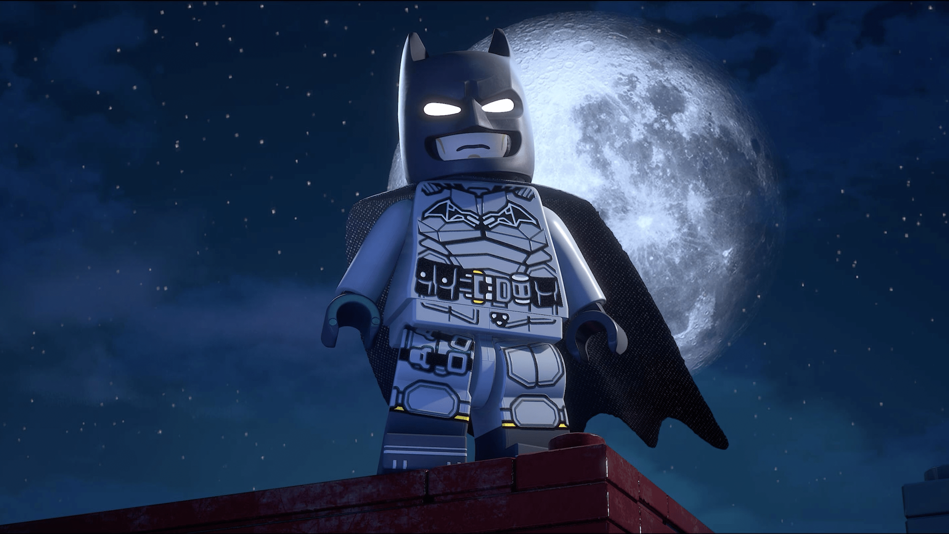 Video game scene: Lego Batman from Lego Batman: Legacy of the Dark Knight stands on a rooftop at night beneath a full moon — 4K Ultra HD PC desktop wallpaper.