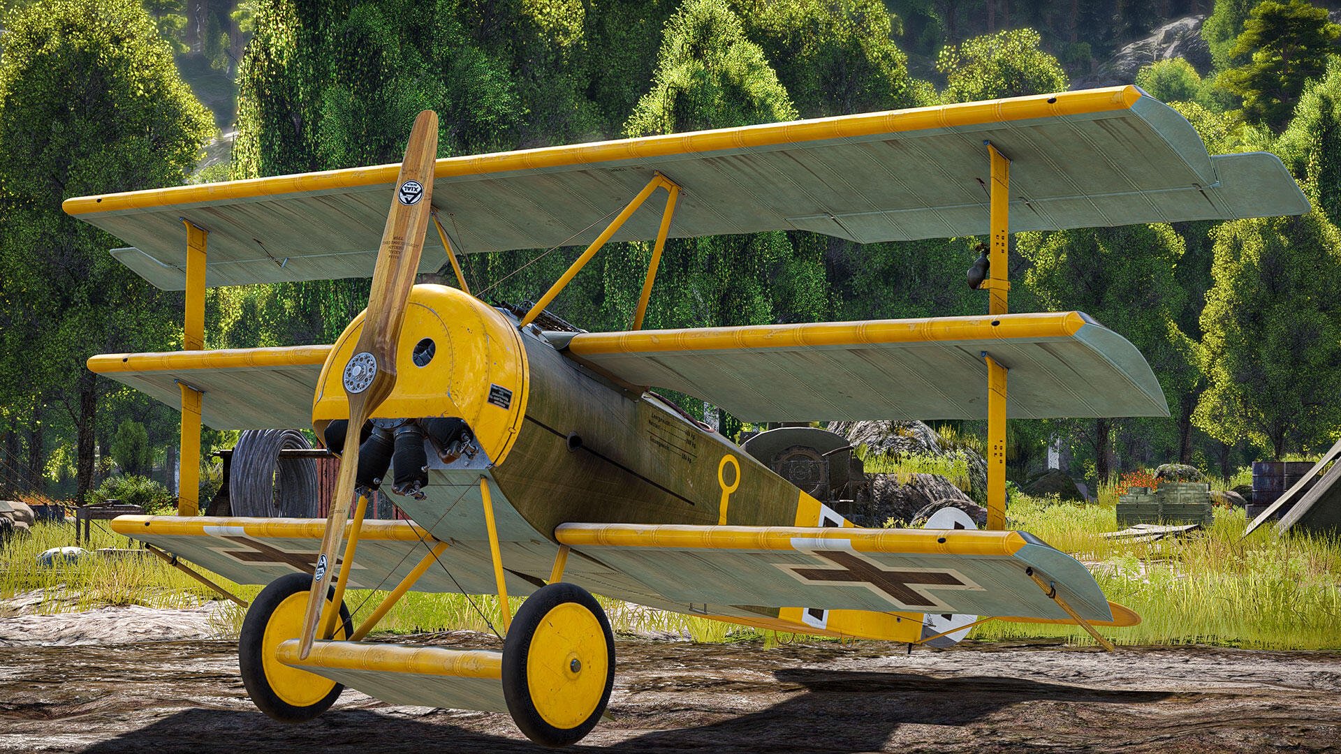 HD PC desktop wallpaper of an Aces of Thunder Fokker Dr.I triplane in yellow livery parked on grass with forest backdrop — detailed video game rendering