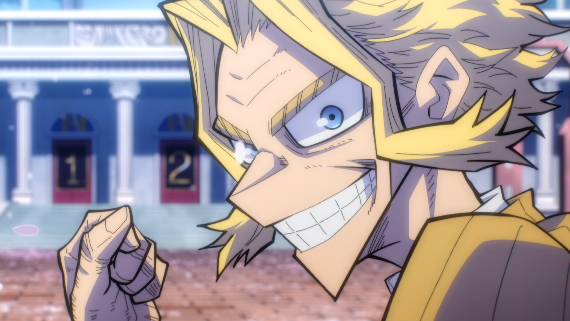 HD PC desktop wallpaper of All Might (My Hero Academia): close-up, confident grin and clenched fist with stadium stands blurred in the background.