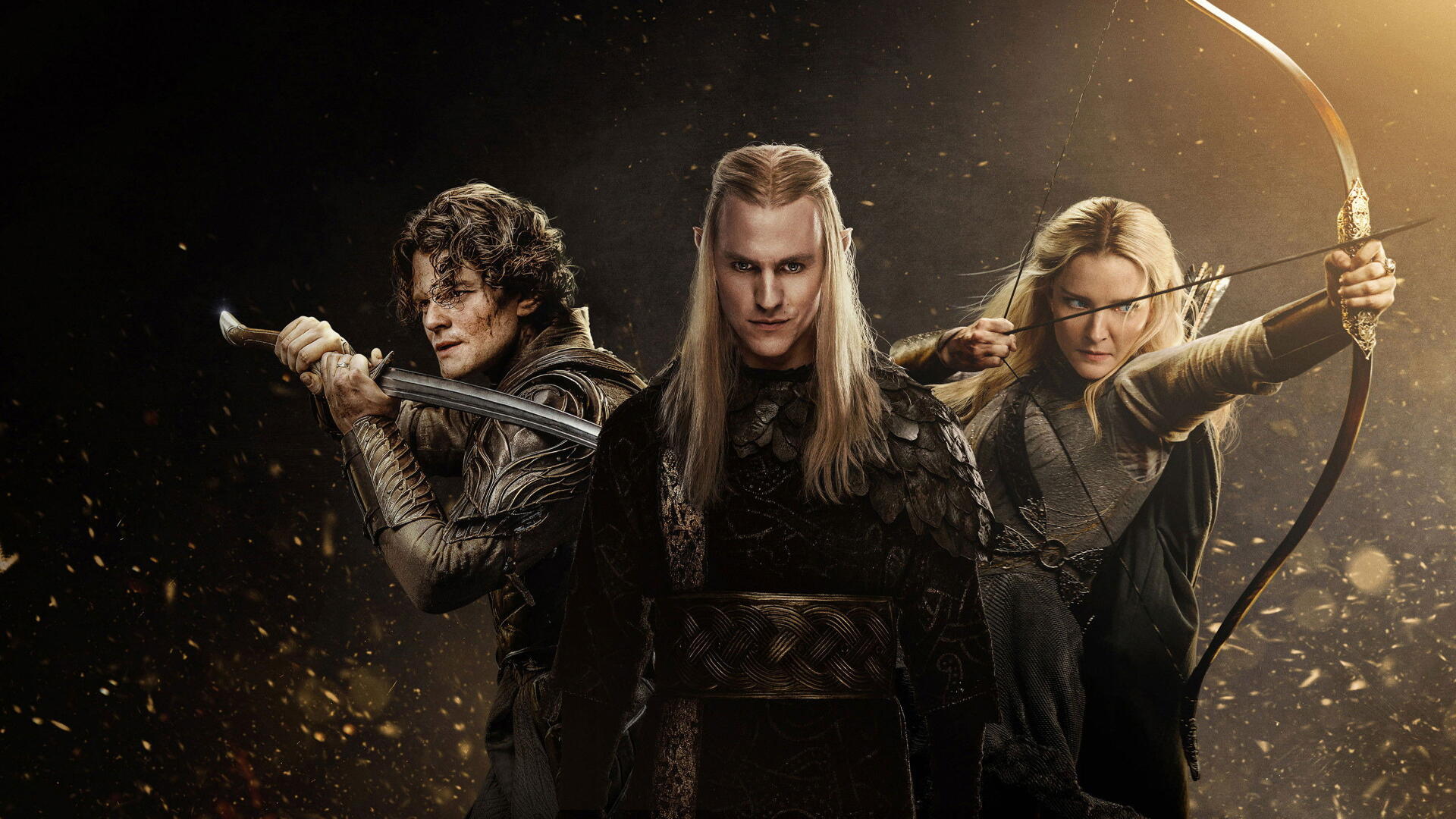 Three elven warriors: a stern central leader with a swordsman and an archer at his sides in a dark, cinematic scene. The Lord of the Rings: The Rings of Power — 4K Ultra HD PC desktop wallpaper.