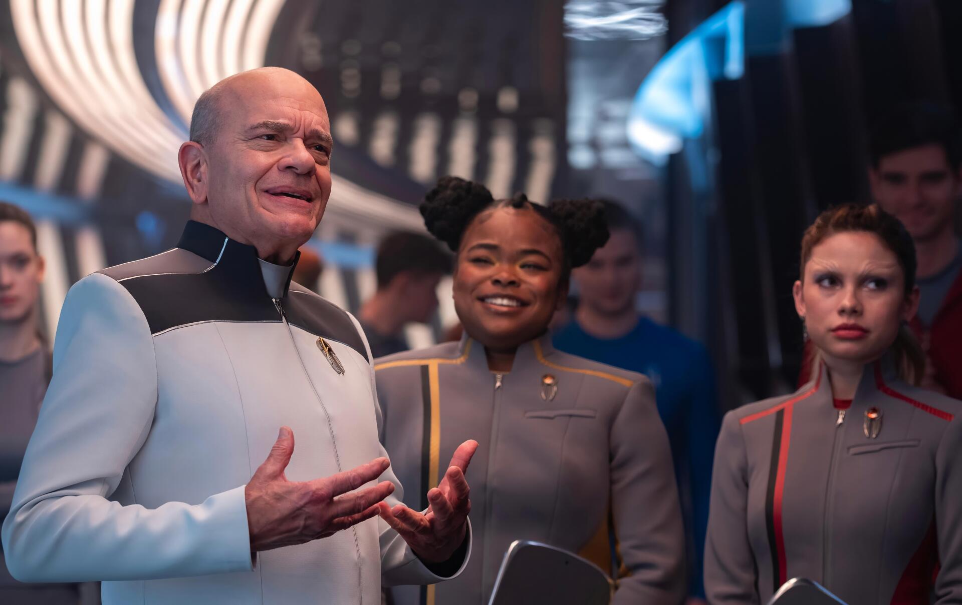 Star Trek: Starfleet Academy TV show — three Starfleet officers in a futuristic academy corridor; 4K Ultra HD PC desktop wallpaper and background.