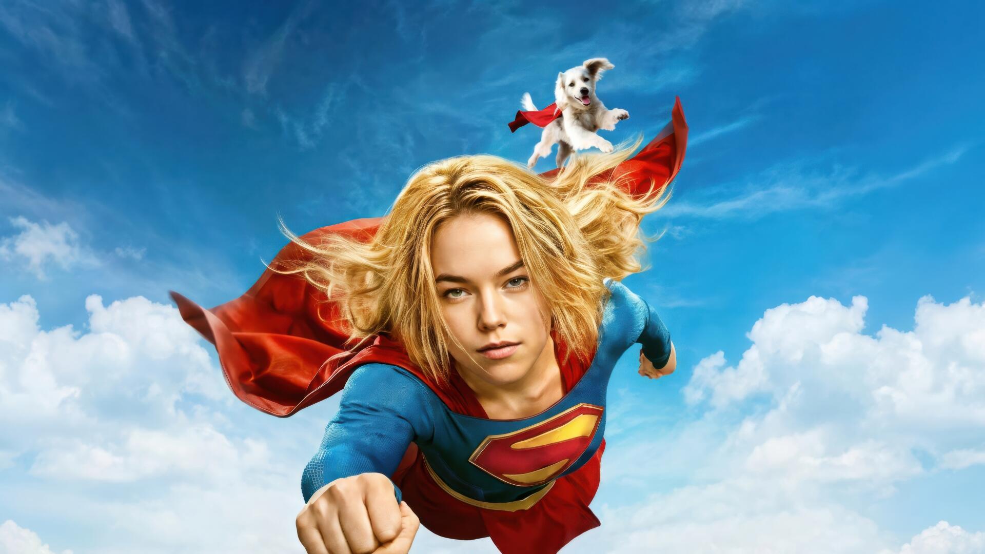 Supergirl (2026) flying toward viewer above bright clouds, red cape billowing — 4K Ultra HD PC desktop wallpaper/background.