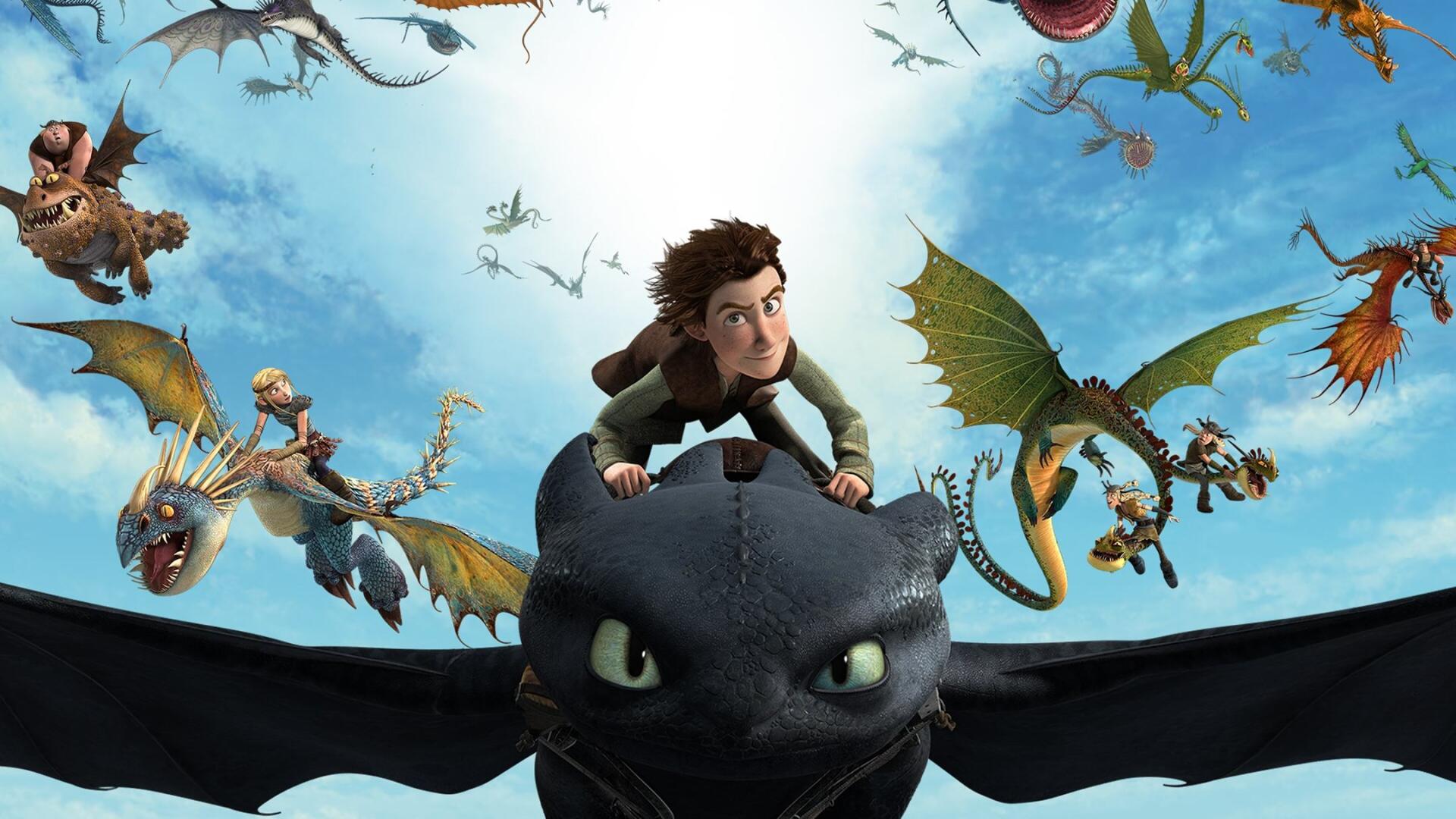HD PC desktop wallpaper from Dragons: Riders of Berk — Hiccup riding Toothless at the forefront with other dragon riders soaring across a bright blue sky.