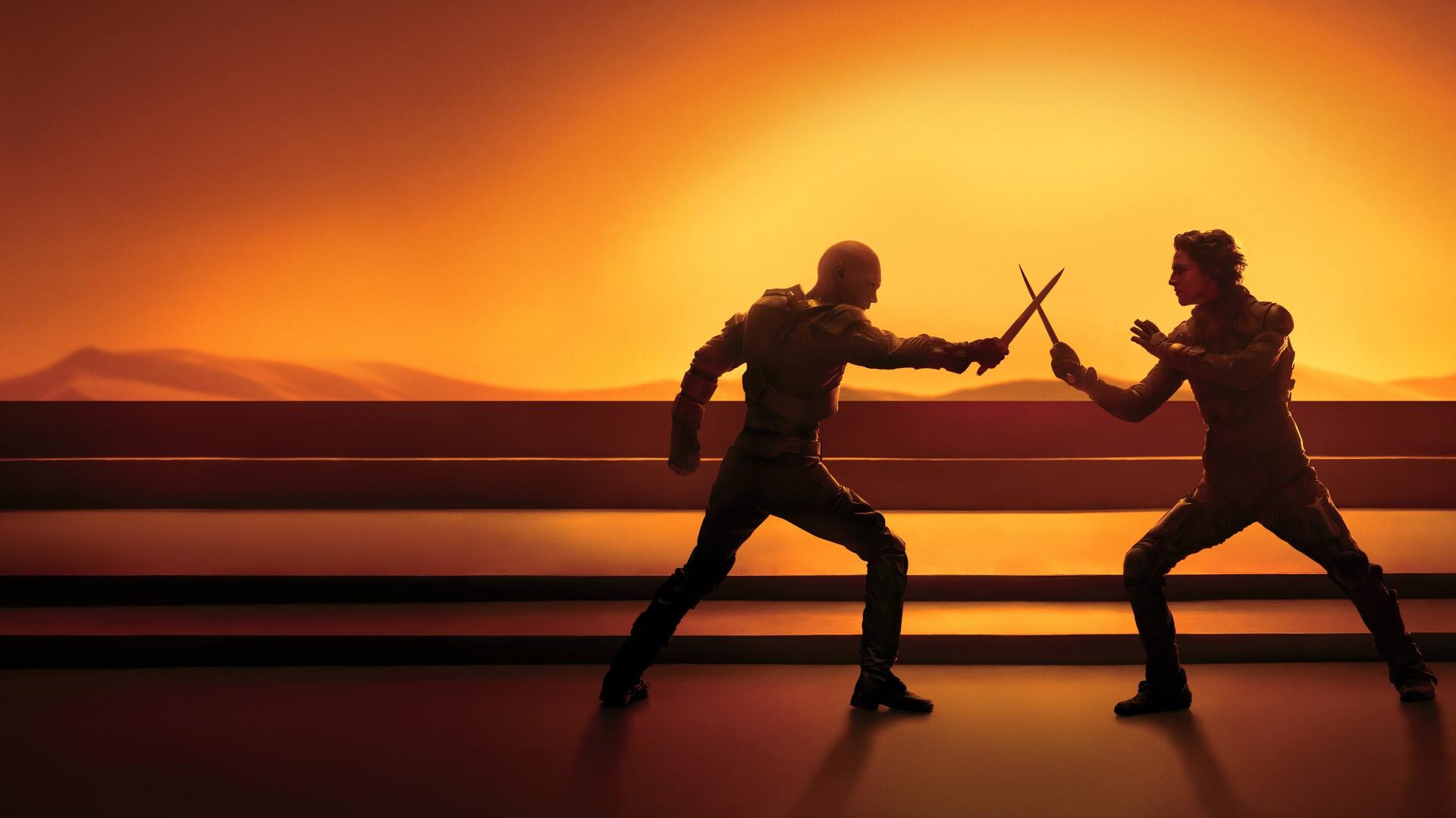 Two silhouetted figures clash blades against a glowing orange horizon — Dune: Part Two 4K Ultra HD PC desktop wallpaper and background.