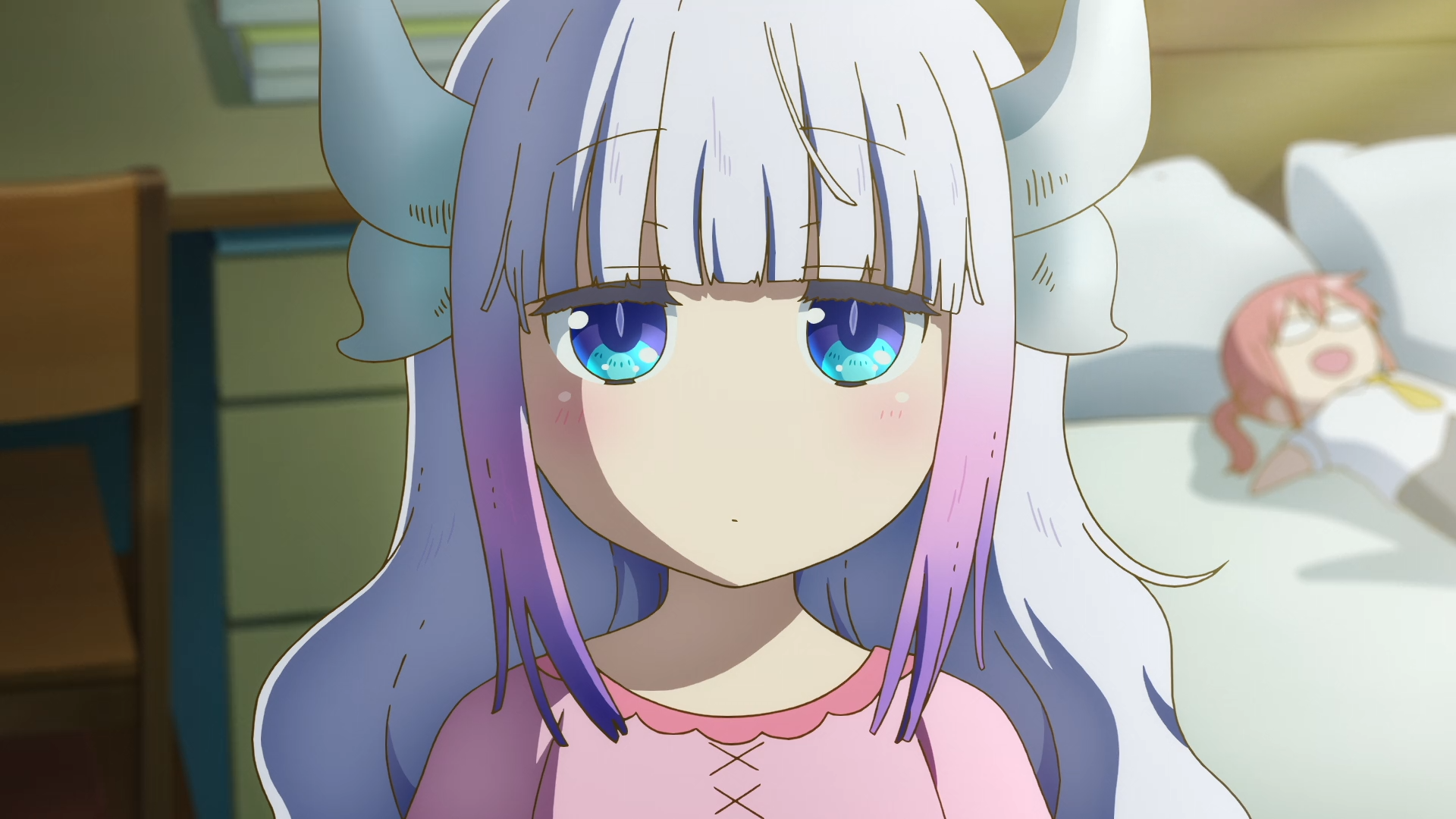 Kanna Kamui from Miss Kobayashi’s Dragon Maid: A Lonely Dragon Wants to Be Loved gazes with big blue eyes in a softly lit bedroom — HD PC desktop wallpaper.