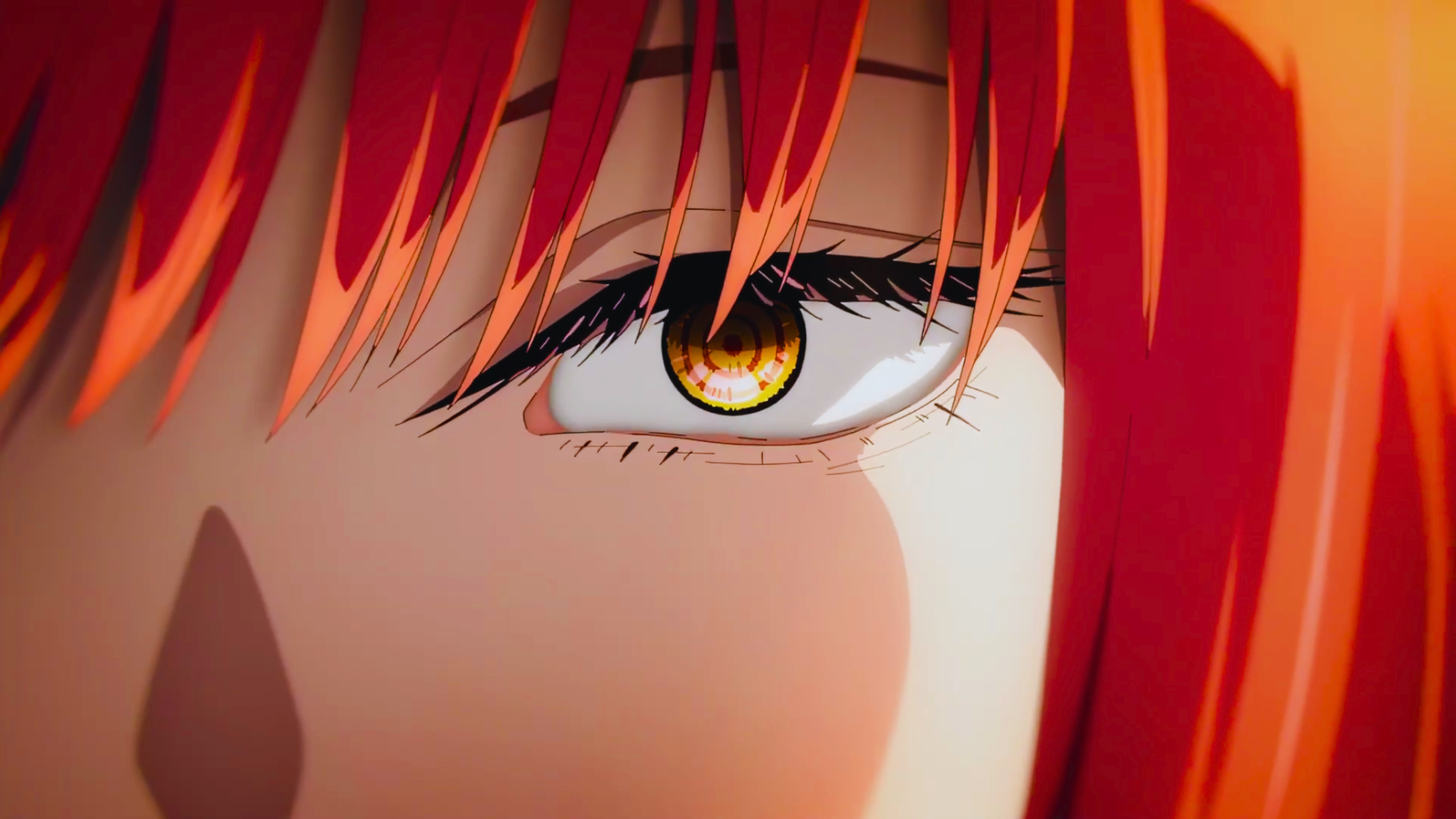 Close-up of Makima's eye from Chainsaw Man, an anime girl with vibrant red hair and a glowing golden iris — 4K Ultra HD PC desktop wallpaper.