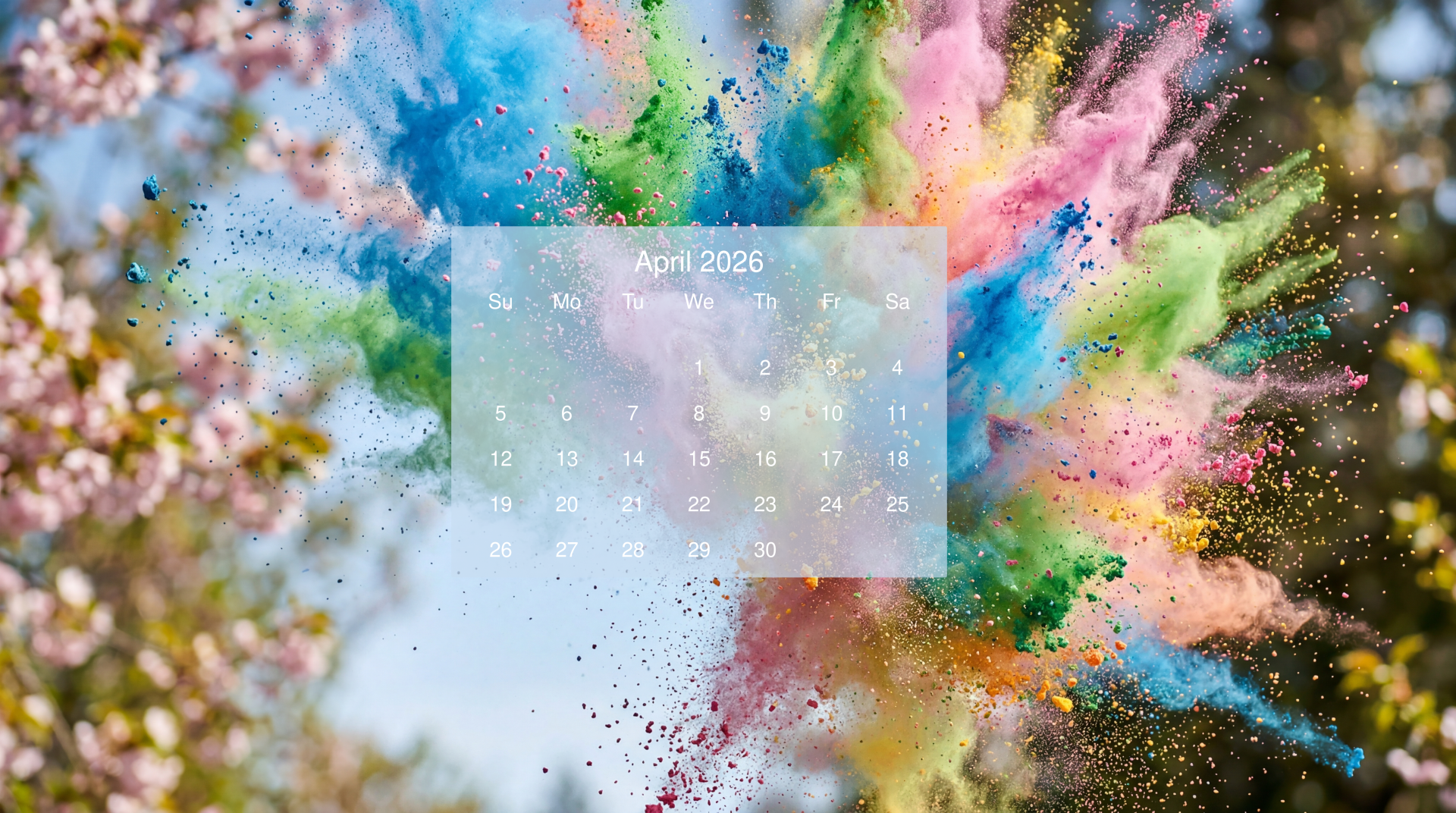 April 2026 calendar over a burst of colorful powder and spring blossoms — 5K Ultra HD PC desktop wallpaper and background.