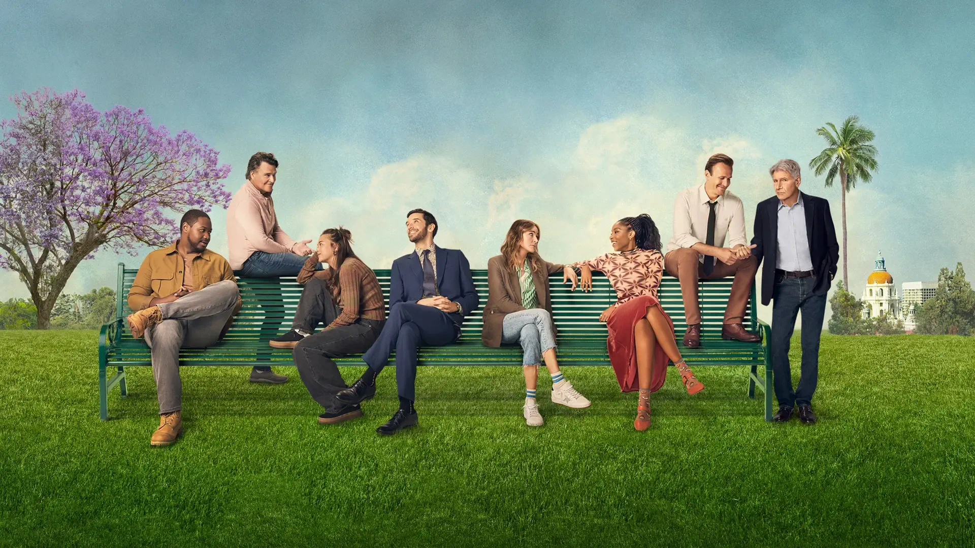 Wallpaper Shrinking — 4K Ultra HD PC desktop background of eight people on an oversized park bench across a green lawn beneath blue sky, with a flowering tree and distant palm-lined building.