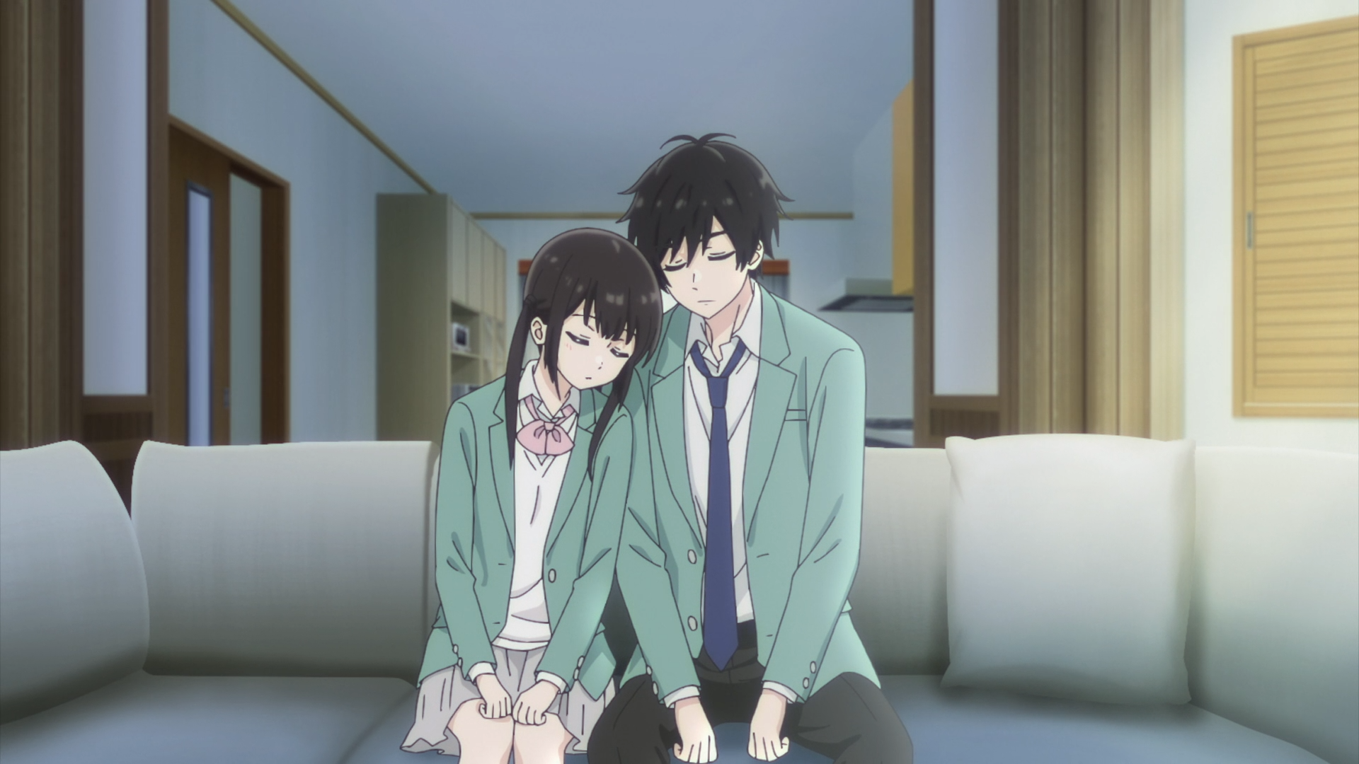 Anime HD PC desktop wallpaper: Miku Sakura and Yukiya Asagi from I Want to End this Love Game sit together on a couch in school uniforms, leaning heads in a quiet, tender moment.