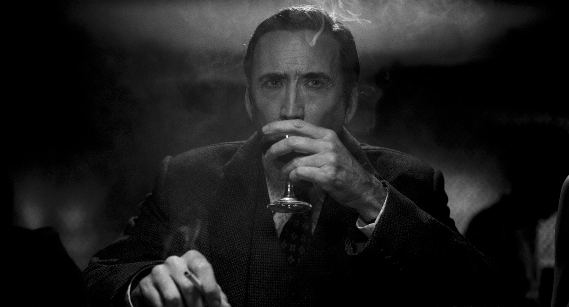 Black-and-white 2K Quad HD PC wallpaper for TV show Spider-Man Noir (2026): brooding trench‑coated figure in a smoky bar, sipping a drink under heavy, dramatic lighting.