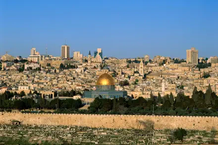 HD PC desktop wallpaper background: panoramic Jerusalem cityscape with the golden Dome of the Rock rising above stone buildings beneath a clear blue sky.