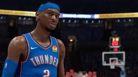 HD PC wallpaper: video game rendering from NBA 2K26 of a Thunder guard in blue jersey and headband, realistic close-up on court with hoop and arena lights in the background.