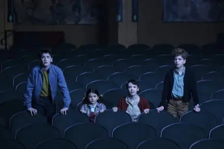 HD PC desktop wallpaper and background: four kids sitting in an empty theater, wide-eyed and surprised — a scene from the TV show It: Welcome to Derry.