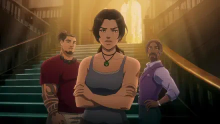 HD PC desktop wallpaper of TV show 'Tomb Raider: The Legend of Lara Croft' — Lara Croft stands arms crossed with two allies on a grand staircase, warm backlighting.