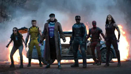 4K Ultra HD PC desktop wallpaper: Deadpool and Wolverine lead a ragtag team standing before a battered car and smoky sky, poised for action.