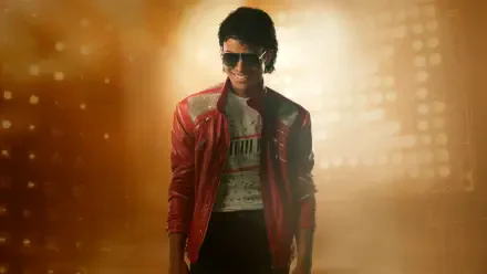 Wallpaper titled Michael (2026): stylized figure in a red jacket and sunglasses bathed in golden light — 5K Ultra HD PC desktop wallpaper and background.