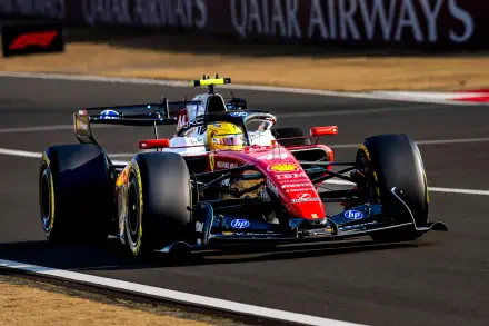 2K Quad HD desktop wallpaper of a Ferrari F1 Scuderia Ferrari racing car on track, helmeted driver (driver identity not disclosed).