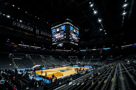 HD PC desktop wallpaper and background: wide-angle shot of an NCAA basketball arena featuring the Purdue Boilermakers court, empty stands, and a central scoreboard under arena lighting.