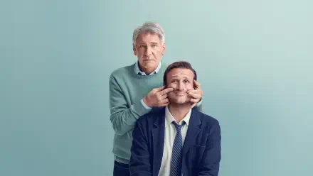 Shrinking-themed 4K Ultra HD PC desktop wallpaper: an older man playfully pinching the cheeks of a seated younger man against a soft teal background.