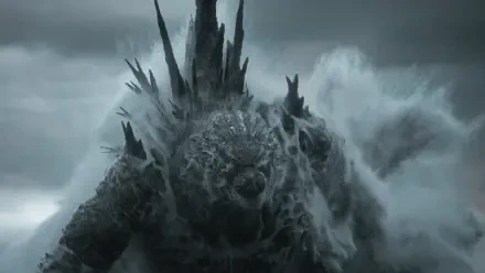 Godzilla Minus Zero rising from a stormy sea, icy scales and towering spines amid crashing waves — 4K Ultra HD PC desktop wallpaper/background.