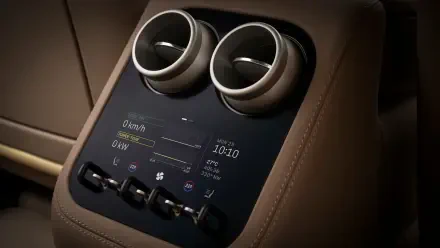 4K Ultra HD PC desktop wallpaper of a Ferrari Luce vehicle interior: brown leather center console with twin round vents and a digital control display.