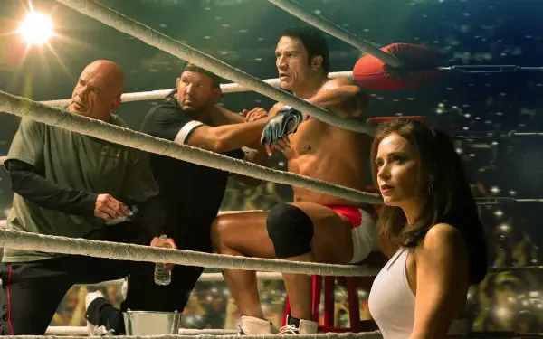 Gritty ring-side boxing scene titled The Smashing Machine, 4K Ultra HD PC desktop wallpaper and background of a fighter on his stool with trainers and a concerned woman at ringside.