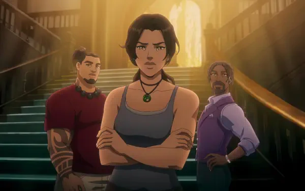 HD PC desktop wallpaper of TV show 'Tomb Raider: The Legend of Lara Croft' — Lara Croft stands arms crossed with two allies on a grand staircase, warm backlighting.