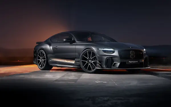 Black Bentley Continental GT luxury car on dimly lit tarmac, glossy body and sporty wheels — 5K Ultra HD desktop wallpaper/background.