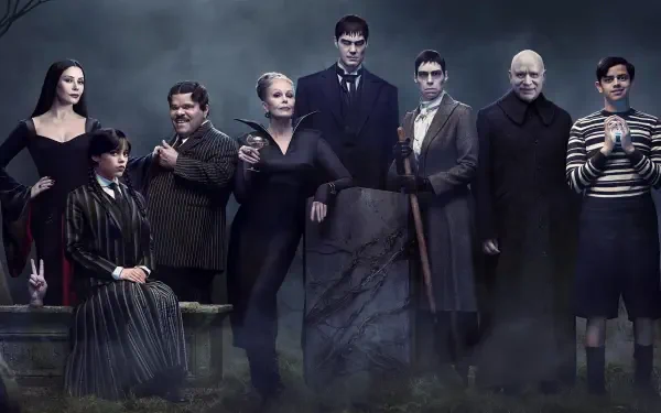 HD PC desktop wallpaper: moody gothic family portrait featuring Wednesday and her eerie relatives standing amid fog under a slate-blue sky.