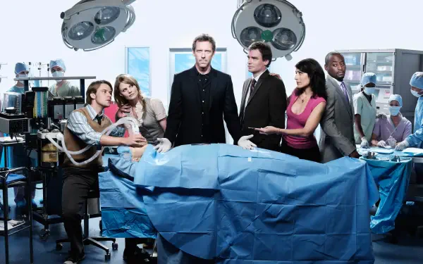 Dr. House and team around an operating table under surgical lights, dramatic medical scene — 4K Ultra HD PC desktop wallpaper/background.