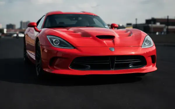 Red Dodge Viper SRT parked on a city street, front view; 5K Ultra HD PC desktop wallpaper and background.