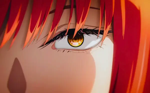 Close-up of Makima's eye from Chainsaw Man, an anime girl with vibrant red hair and a glowing golden iris — 4K Ultra HD PC desktop wallpaper.