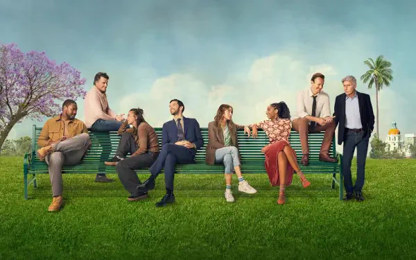 Wallpaper Shrinking — 4K Ultra HD PC desktop background of eight people on an oversized park bench across a green lawn beneath blue sky, with a flowering tree and distant palm-lined building.
