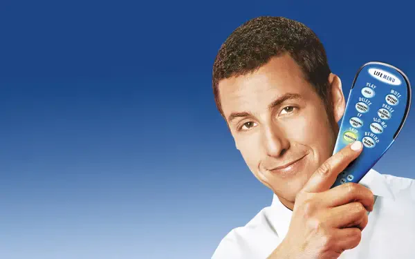 4K Ultra HD PC desktop wallpaper for Click (2006): smiling man in a white shirt holds an oversized TV remote against a smooth blue gradient background.