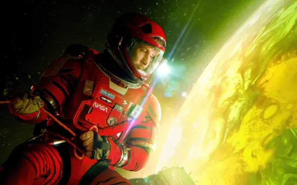 4K Ultra HD desktop wallpaper from the movie Project Hail Mary: astronaut in a red suit drifting beside a luminous green-yellow planet, helmet visor reflecting distant starlight.
