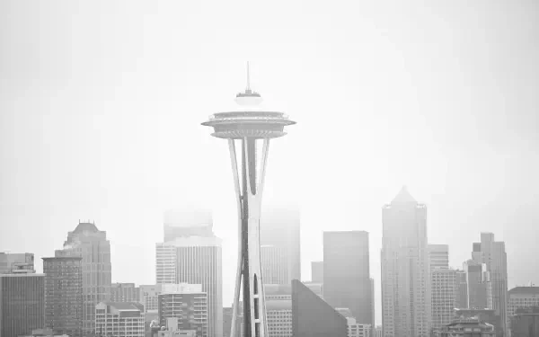 Monochrome 5K Ultra HD photography of the Seattle skyline with the Space Needle centered against a white sky, PC desktop wallpaper/background.