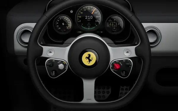Ferrari Luce vehicle steering wheel with prancing horse emblem and illuminated dashboard gauges — 4K Ultra HD PC desktop wallpaper/background.