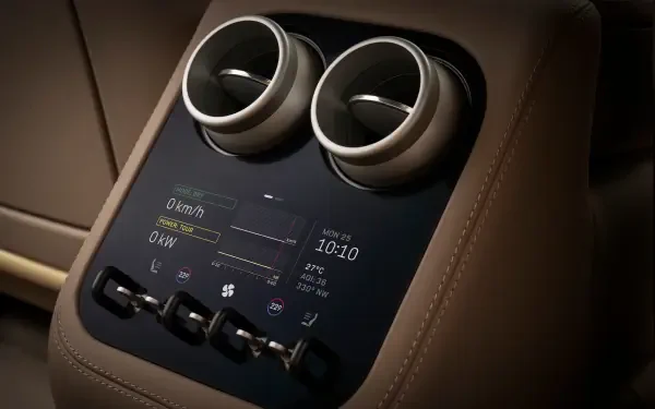 4K Ultra HD PC desktop wallpaper of a Ferrari Luce vehicle interior: brown leather center console with twin round vents and a digital control display.