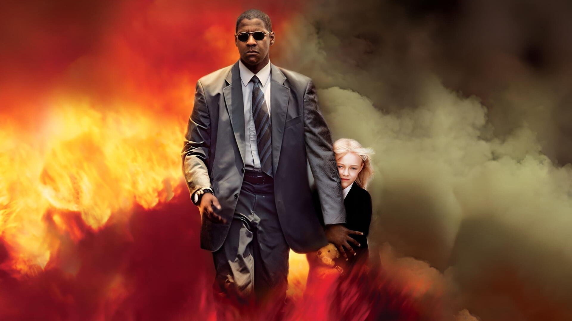 Man on Fire (2004) 2K Quad HD PC desktop wallpaper: suited man in sunglasses strides through flames, gun in hand, shielding a young blond girl amid smoke.