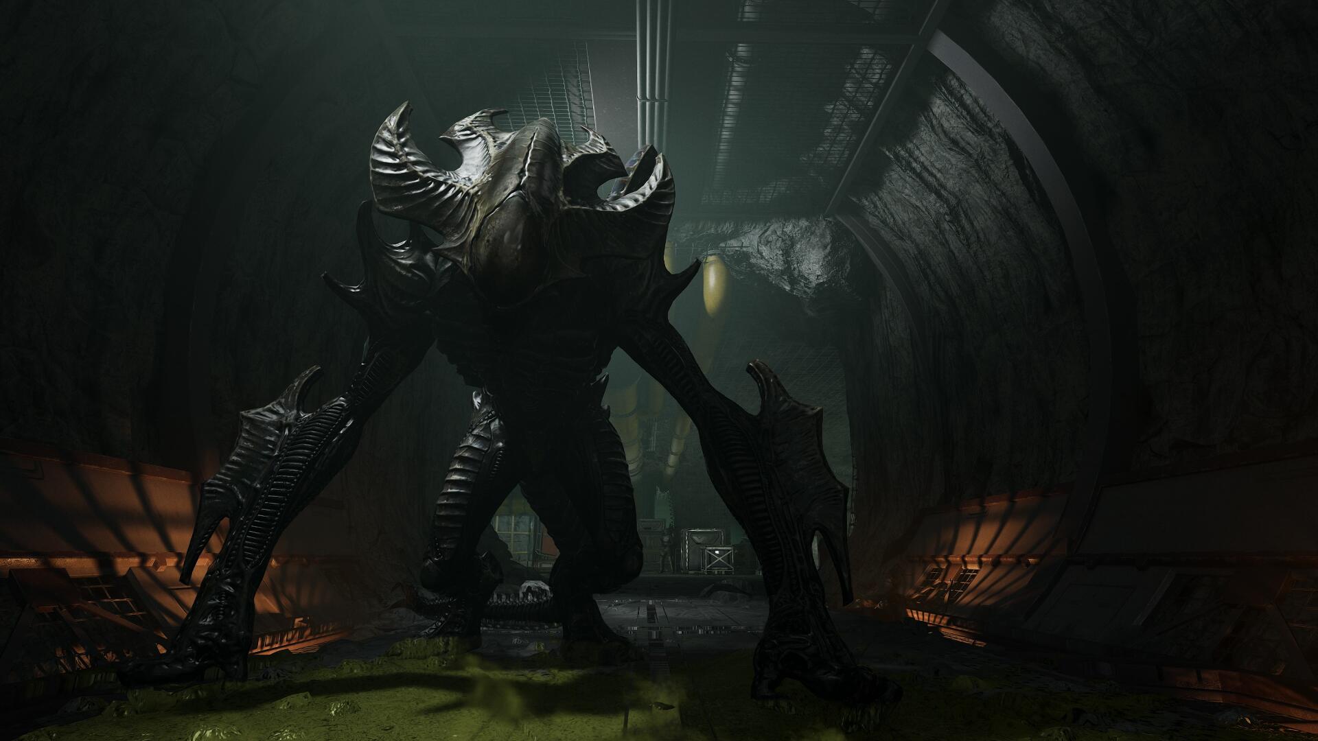 4K Ultra HD PC desktop wallpaper: video game Aliens: Fireteam Elite 2 monster — a towering dragon-like alien in a dark industrial cavern, backlit by eerie green light.