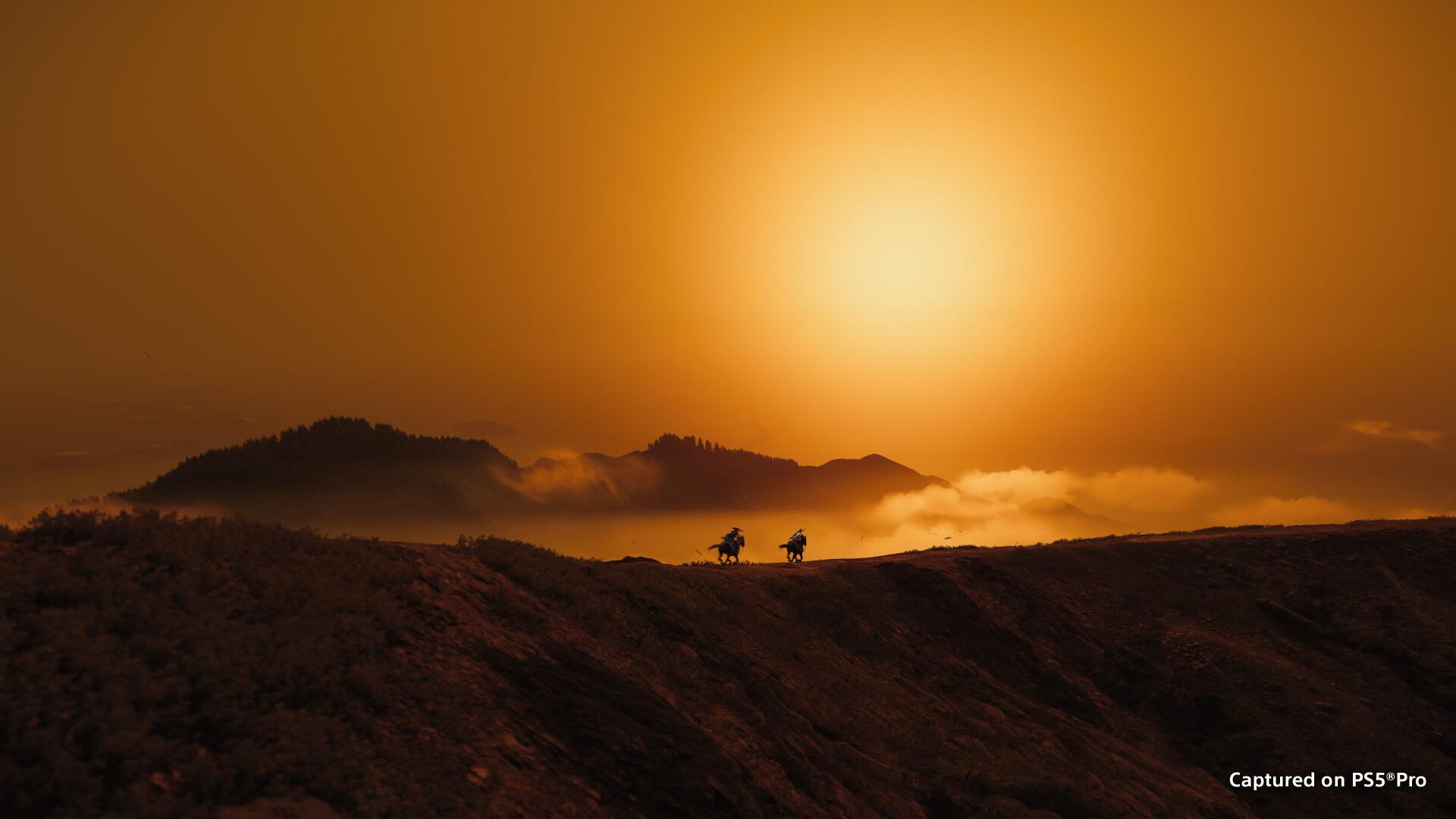 4K Ultra HD PC desktop wallpaper: golden sunrise over Ghost of Yōtei, misty mountain landscape with dark silhouettes along a ridge.